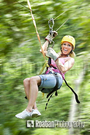 Excited_woman_on_zipline_in_jungle_motion_blur