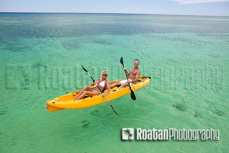 Happy couple kayaking in Caribbean Sea Stock Photo