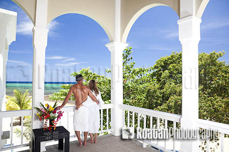 Romantic couple overlooking scenic Caribbean Sea stock photo