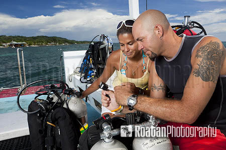 Buddies reviewing dive plan stock photo